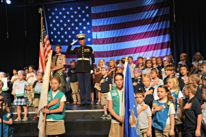 Retired U.S. Marine Core and MCS parent Dwight Hanson leads the posting of the colors.