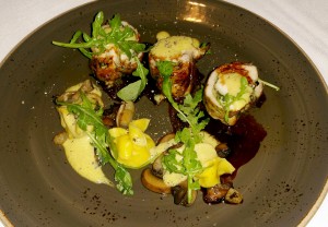 “You’re Going Out There a Youngster, but You’ve Got to Come Back a Star” dish of crisp chicken roulade with parsnip tortellini, pear, forest mushroom sabayon and wild arugula