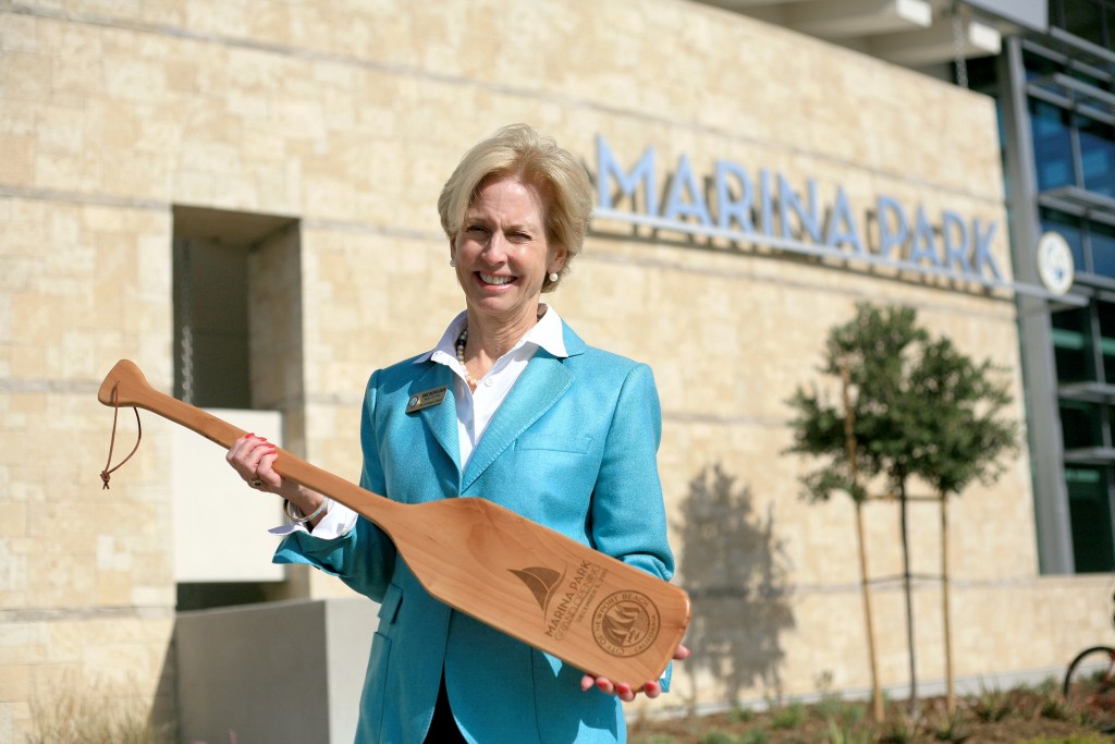 New Mayor Diane Dixon poses for a photo with a commemorative Marina Park grand opening oar on Saturday. — Photo by Sara Hall ©