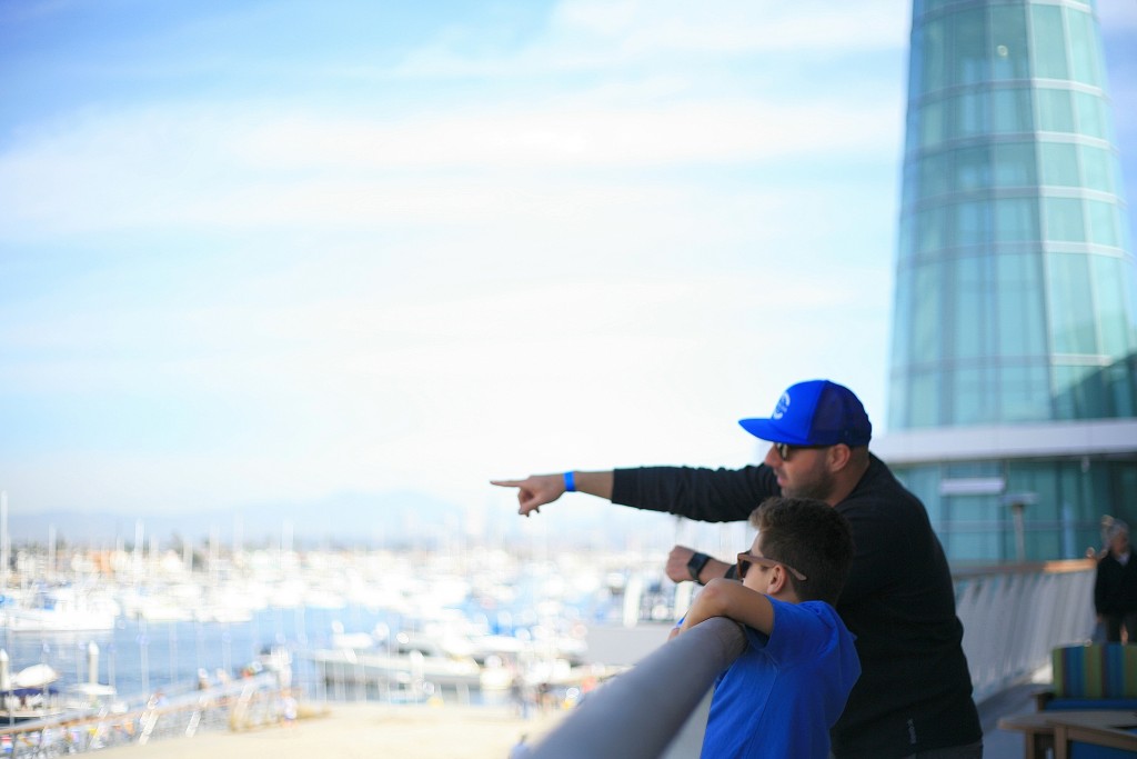 Peninsula residents Kev Haleblian and his son, Brandyn, 8, look out over the bay from Marina Park during the grand opening event on Saturday. — Photo by Sara Hall ©