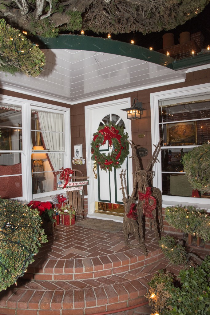 The front door is adorned with one of the many wreaths the Busbys used in their decoration this year.  — Photo by Charles Weinberg ©