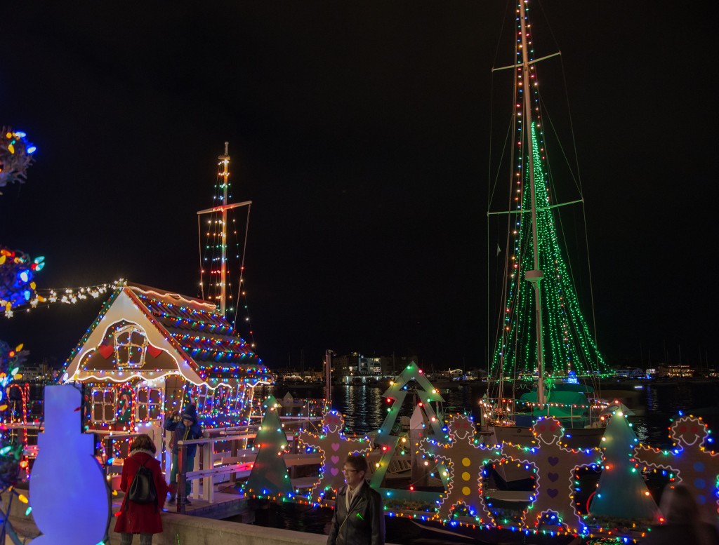 The life-size plywood gingerbread house, gingerbread men on the plank, and a large Christmas tree of lights on Vitarelli's dock. — Photo by Charles Weinberg ©