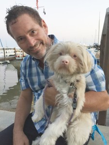 Wilbur, a Malti-Poo, and his human, Duffy Evans