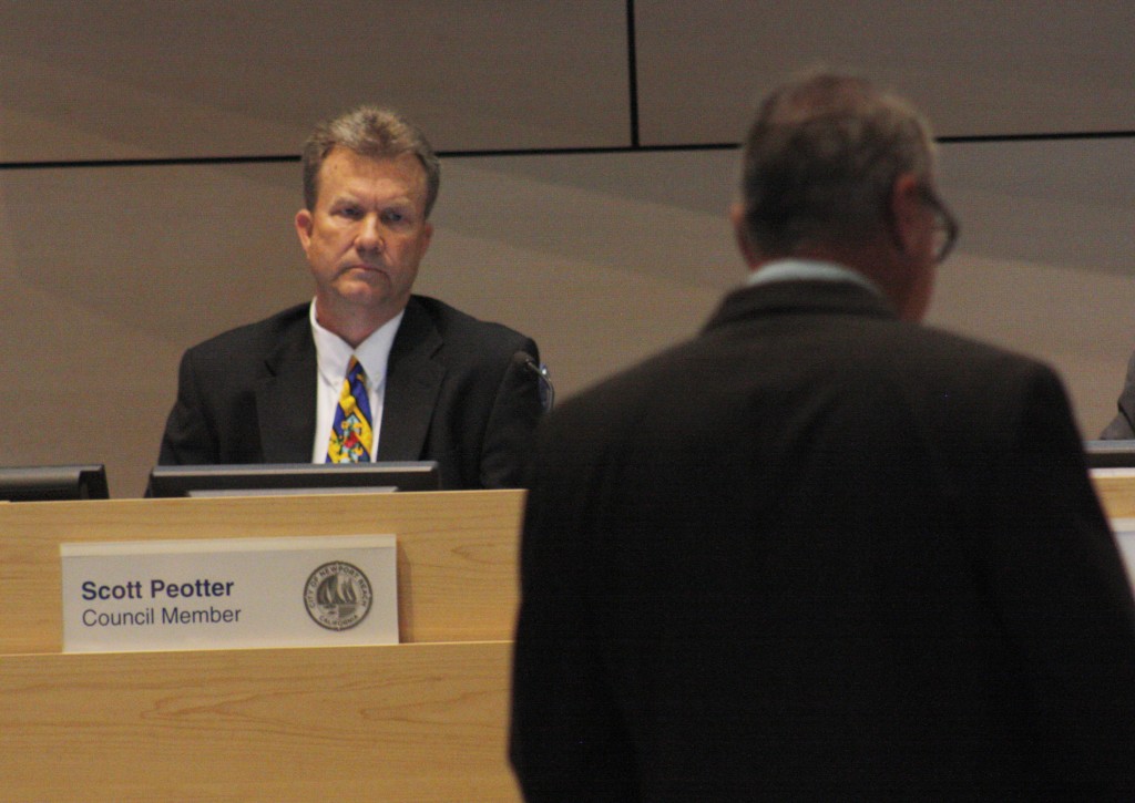 Newport Beach City Councilman Scott Peotter listens to Kevin O'Grady, the executive director of the LGBT Center OC, address the council at City Council meeting. — Photo by Christopher Trela©