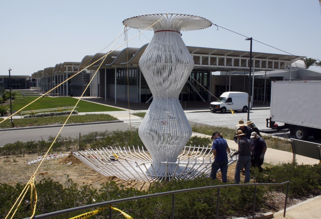 Workers assemble “La Cage aux Folles” by Warren Techentin, part of the new set of sculptures installed in the Civic Center Park. — Photo by Christopher Trela©