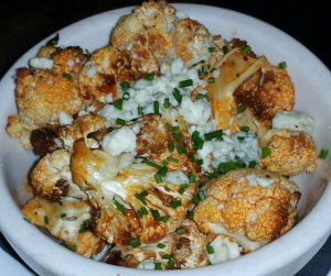 Roasted cauliflower with red hot pepper sauce and gorgonzola crumbles