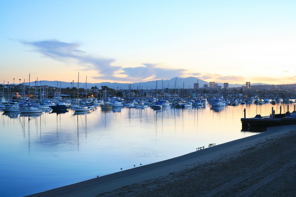 The sun rises over the moorings in Newport Harbor on Thursday.  — Photo by Sara Hall ©