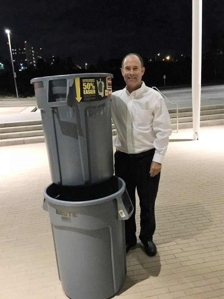 Bruce Horn with the trashcans he presented to the Planning Commission as a visual comparison to the size of the cell tower. — Photo courtesy Bruce Horn ©