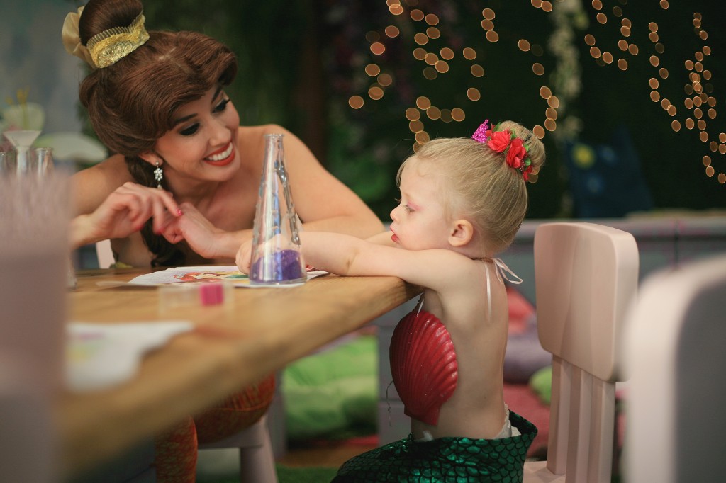 Princess Belle chats with Berlin Martin, 2, during Mermaid Monday at Once Upon an Island on Feb. 8. — Photo by Sara Hall ©