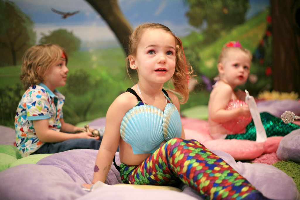 Skylar Amirpur, 3, (middle) gets excited as she sees Princess Belle as Landon, 4, and Berlin Martin, 2, look on in the background. — Photo by Sara Hall ©