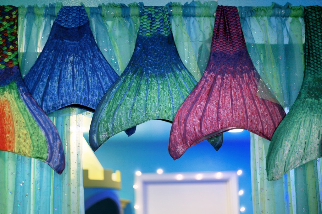 Mermaid tails hung up in the shop. — Photo by Sara Hall ©