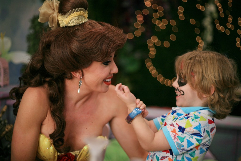 Landon Martin, 4, shows his bracelet to Princess Belle during craft time at Once Upon an Island. — Photo by Sara Hall ©