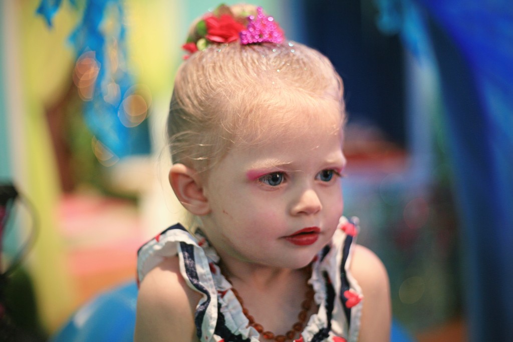 Berlin Martin, 2, checks out her mermaid makeup in the Jellyfish Salon at Once Upon an Island. — Photo by Sara Hall ©