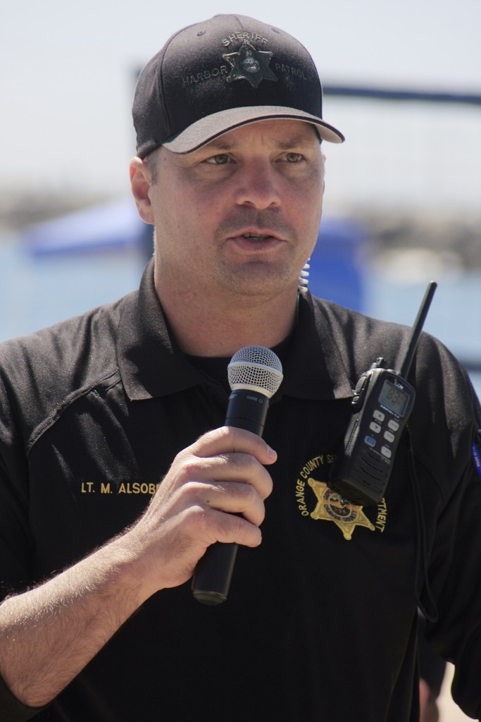 Orange County Sheriff’s Department Harbor Patrol Lt. Mark Alsobrook talks to the crowd during the hot wash, or debriefing discussion, as the drill winds down on Wednesday. — Photo by Sara Hall ©