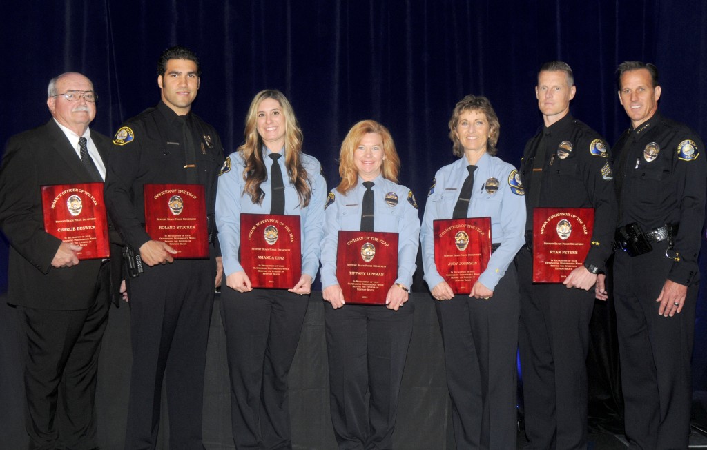 NBPD honorees (left to right): Charlie Beswick, Roland Stucken, Amada Diaz, Tiffany Lippman, Judy Johnson, Ryan Peters, and Chief Jay R. Johnson. — Photo courtesy NBPD ©