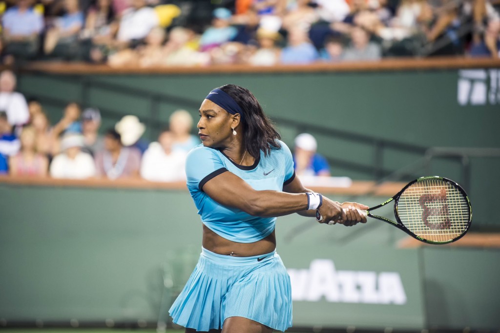 Serena Williams in action before she was defeated by Victoria Azarenka. — Photo by Lawrence Sherwin © 