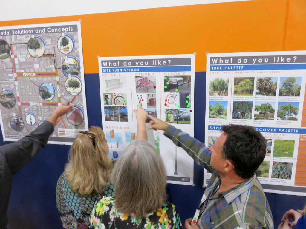 Residents place green and red stickers on the pictures of possible features for the West Newport Mesa Streetscape Master Plan during a public workshop on Wednesday. — Photo by Sara Hall ©