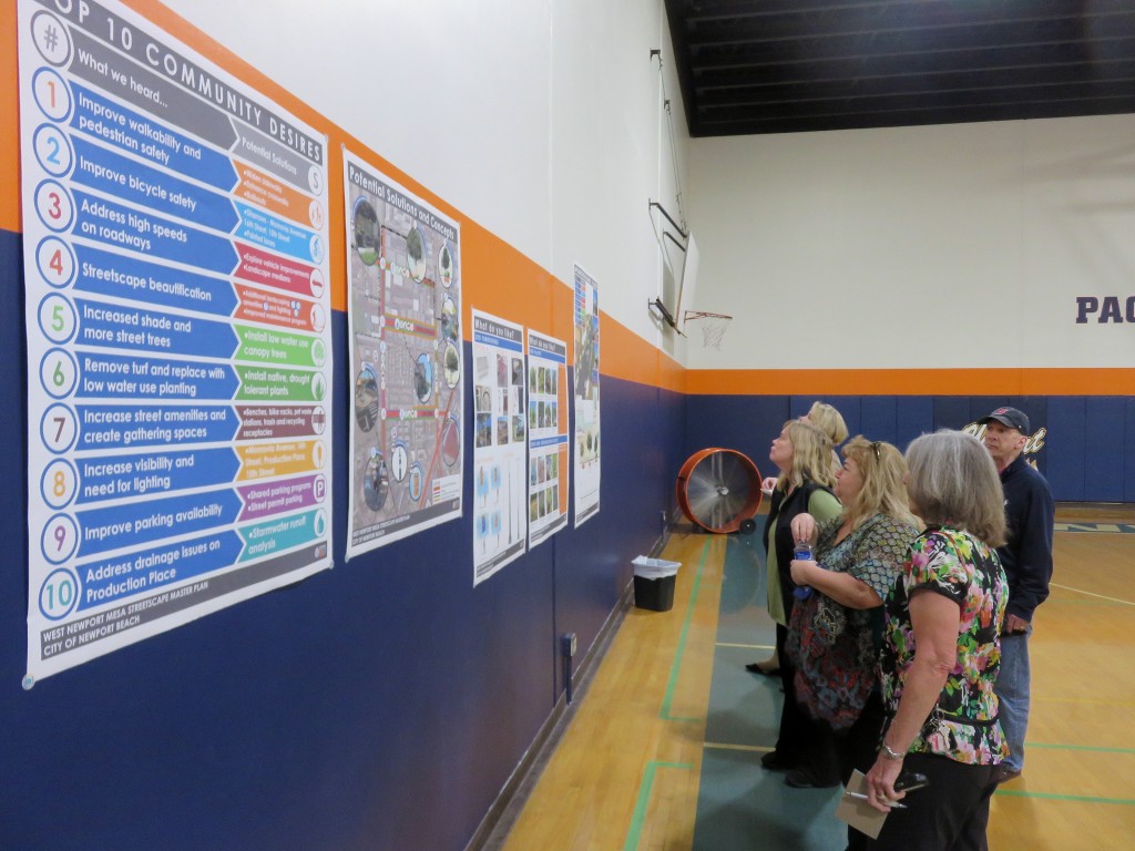 Residents check out the top community comments and concept ideas for the West Newport Mesa Streetscape Master Plan during a public workshop on Wednesday. — Photo by Sara Hall ©