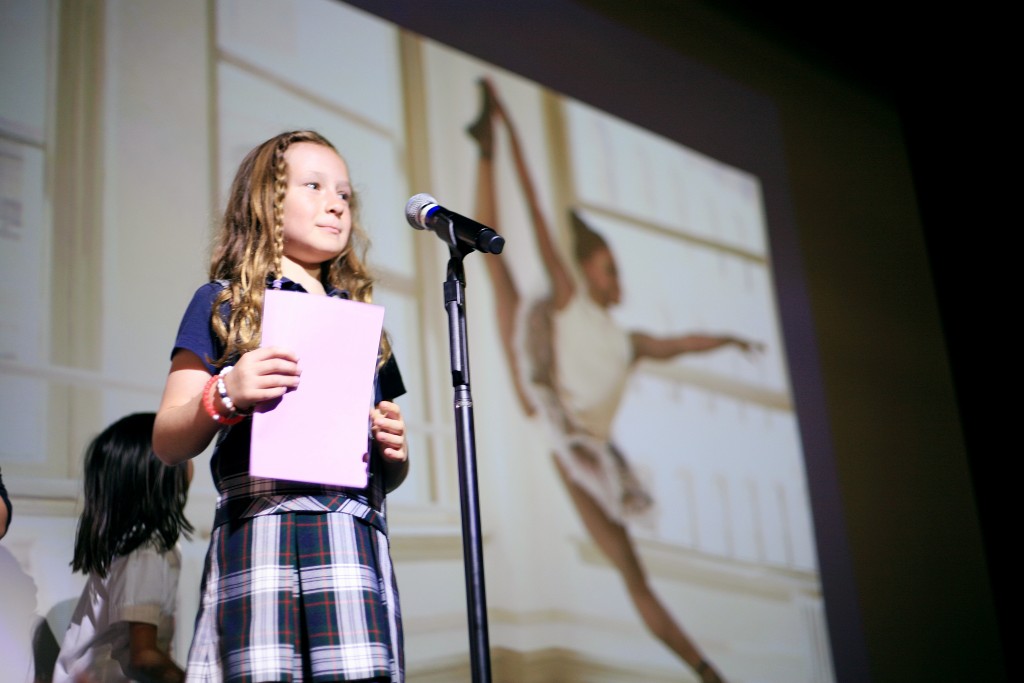 Harbor Day School second grader Ana Cormac plays a guessing game about important women in history during the school’s Phenomenal Women in History event on Wednesday. — Photo by Sara Hall ©