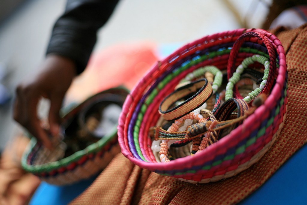 Laguna Niguel student Devonte Boos of the 100 Black Men organization looks through Tanzanian bracelets at the Ethnic Bazaar at the fair. — Photo by Sara Hall ©