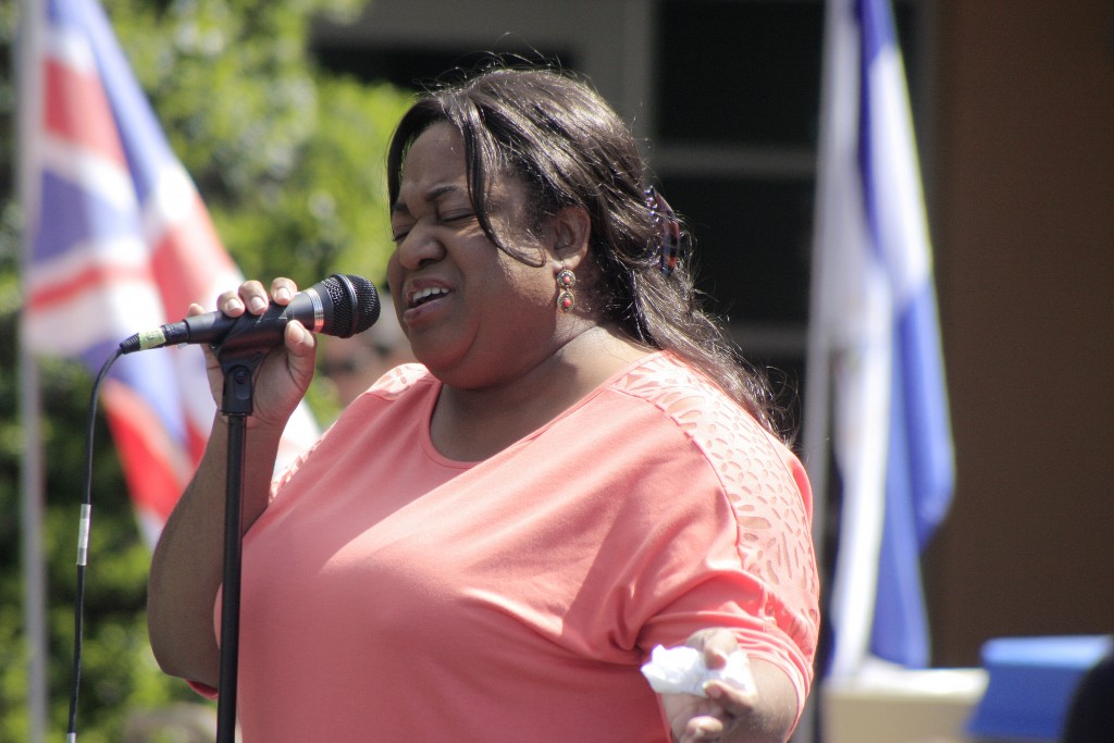 Sage Hill counselor Nicole Thompson sings during the fair. — Photo by Sara Hall ©