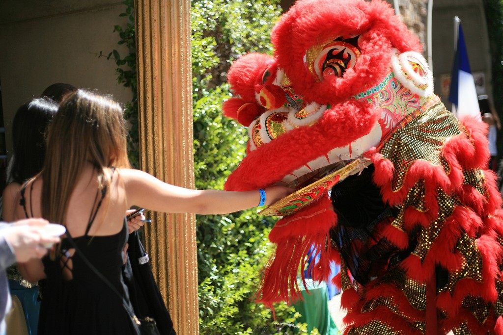 Traditional Chinese lion dancers from the Ane Thanh troupe interact with the crowd during the 15th Annual Sage Hill Multicultural Fair on Saturday. — Photo by Sara Hall ©