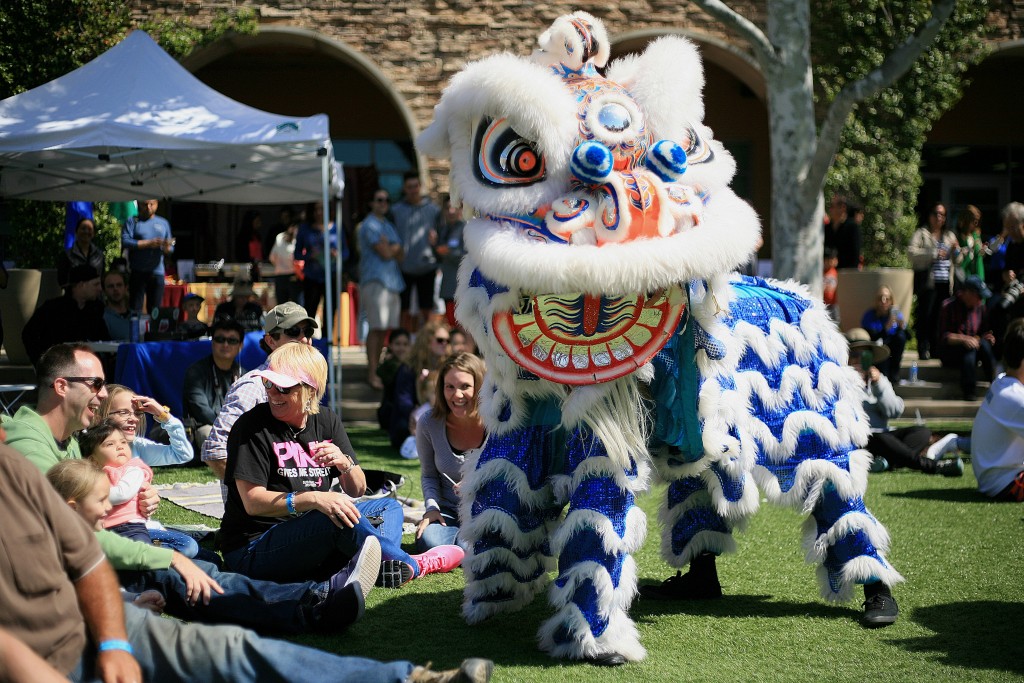 Traditional Chinese lion dancers from the Ane Thanh troupe interact with the crowd during the 15th Annual Sage Hill Multicultural Fair on Saturday. — Photo by Sara Hall ©