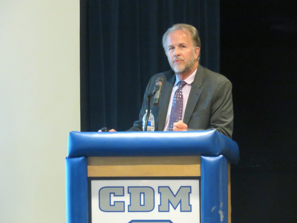 Dwayne Mears, Principal with PlaceWorks, the consultant that prepared the Initial Study for NMUSD, speaks to the crowd during a meeting on Monday about the Corona del Mar High School sports field project. — Photo by Sara Hall ©