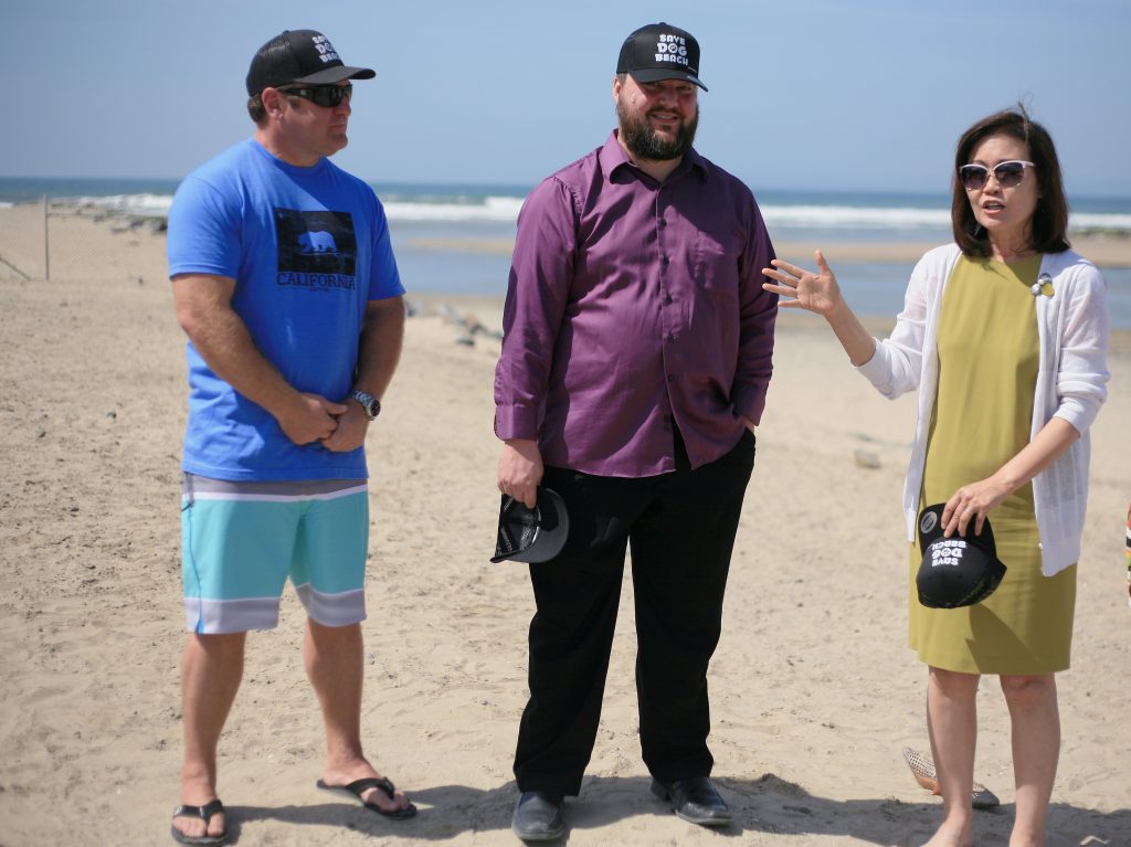 Orange County Board of Supervisors Vice Chair Michelle Steel introduces “Save Dog Beach” organizer Jon Pedersen (left) and council candidate and dog beach proponent Mike Glenn during the press conference. — Photo by Sara Hall ©