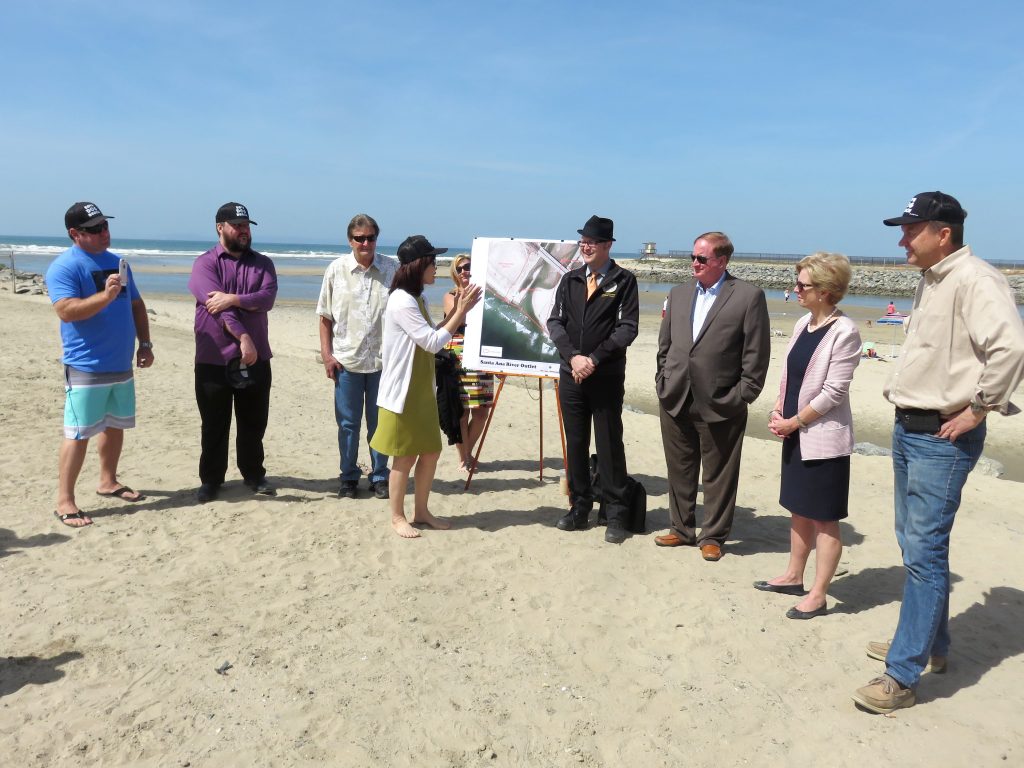 (left to right) “Save Dog Beach” organizer Jon Pedersen, council candidate and dog beach proponent Mike Glenn, Newport Beach Councilman Ed Selich, Orange County Board of Supervisors Vice Chair Michelle Steel (speaking), OC district 2 staffer (holding sign), Assemblyman Matthew Harper, NB Councilman Keith Curry, NB Mayor Diane Dixon, and NB Councilman Scott Peotter. — Photo by Sara Hall ©