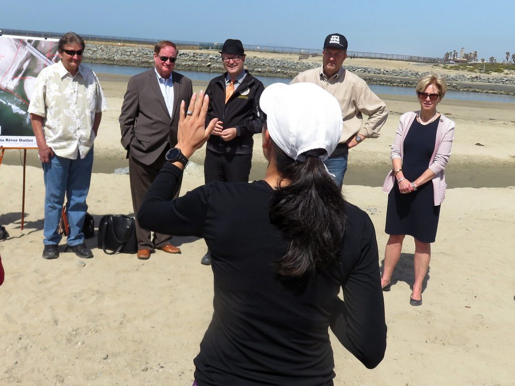 Local resident and dog beach opponent Vivien Hyman speaks to officials (left to right) Newport Beach councilmen Ed Selich and Keith Curry, Assemblyman Matthew Harper, NB Councilman Scott Peotter, and NB Mayor Diane Dixon during a press conference about the area on Saturday. — Photo by Sara Hall ©