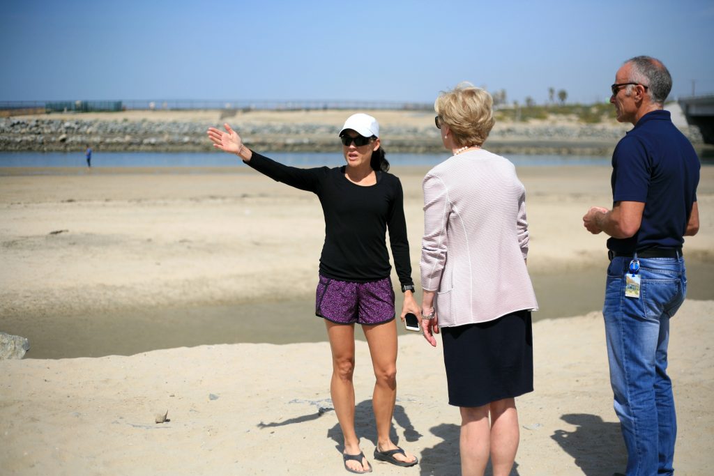 Local resident and dog beach opponent Vivien Hyman speaks Newport Beach Mayor Diane Dixon and NB City Manager Dave Kiff about her concerns regarding the dogs off leash in the area around her home after a press conference on Saturday. — Photo by Sara Hall ©