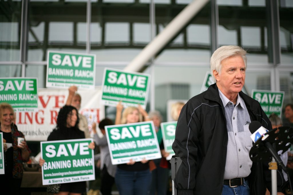 Steve Ray, Executive Director of the Banning Ranch Conservancy, the lead group opposing the project, speaks to a crowd at the NB civic center on Thursday morning before the CCC meeting. — Photo by Sara Hall ©