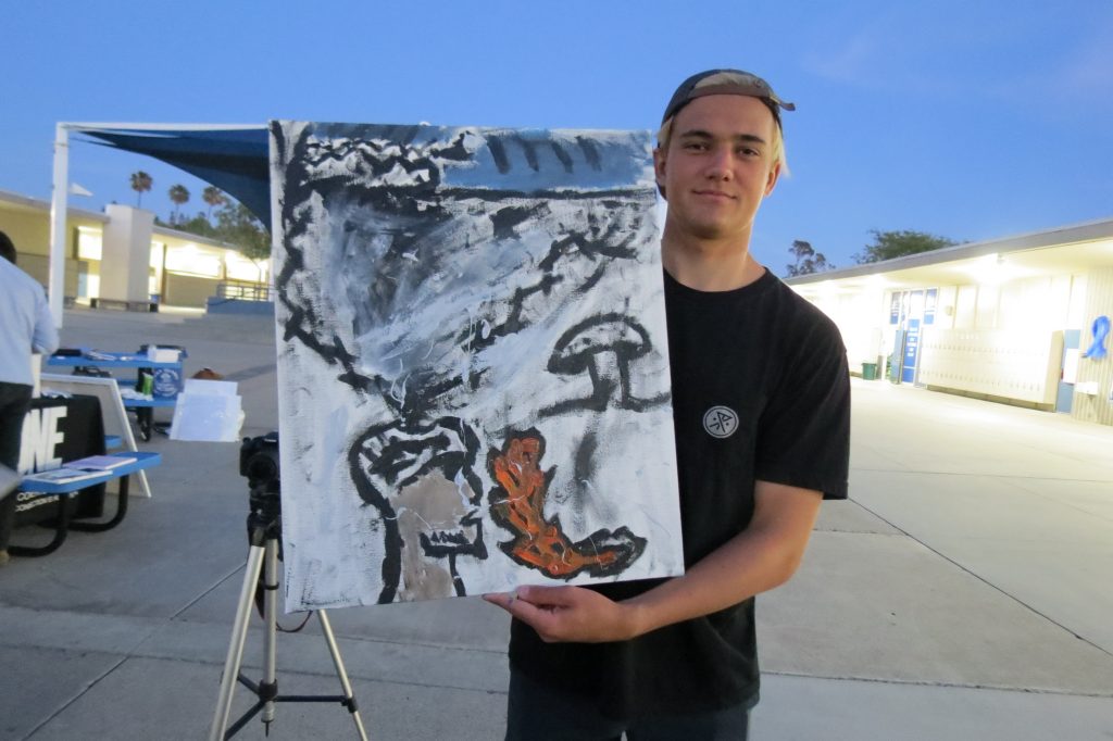 Skylar with the painting he created during a recent One Recovery meeting. — Photo by Elizabeth Greenberg ©