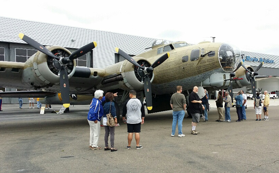 People admire the B-24 Wings of Freedom plane. — Photo by Jim Collins ©