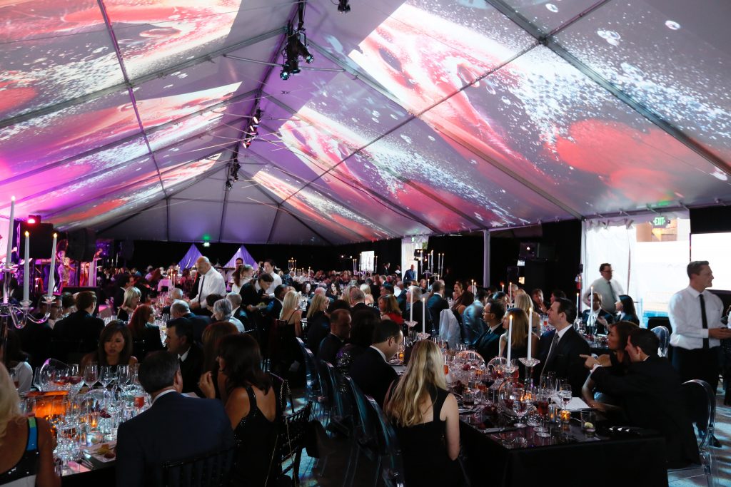 The 2016 Art of Dining honoring Marilyn Minter featured Minter;s artwork projected onto the ceiling of the gala tent (Photo by Ryan Miller/Capture Imaging)