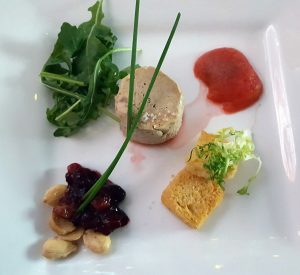 Foie gras terrine with poached plum and brioche toast points