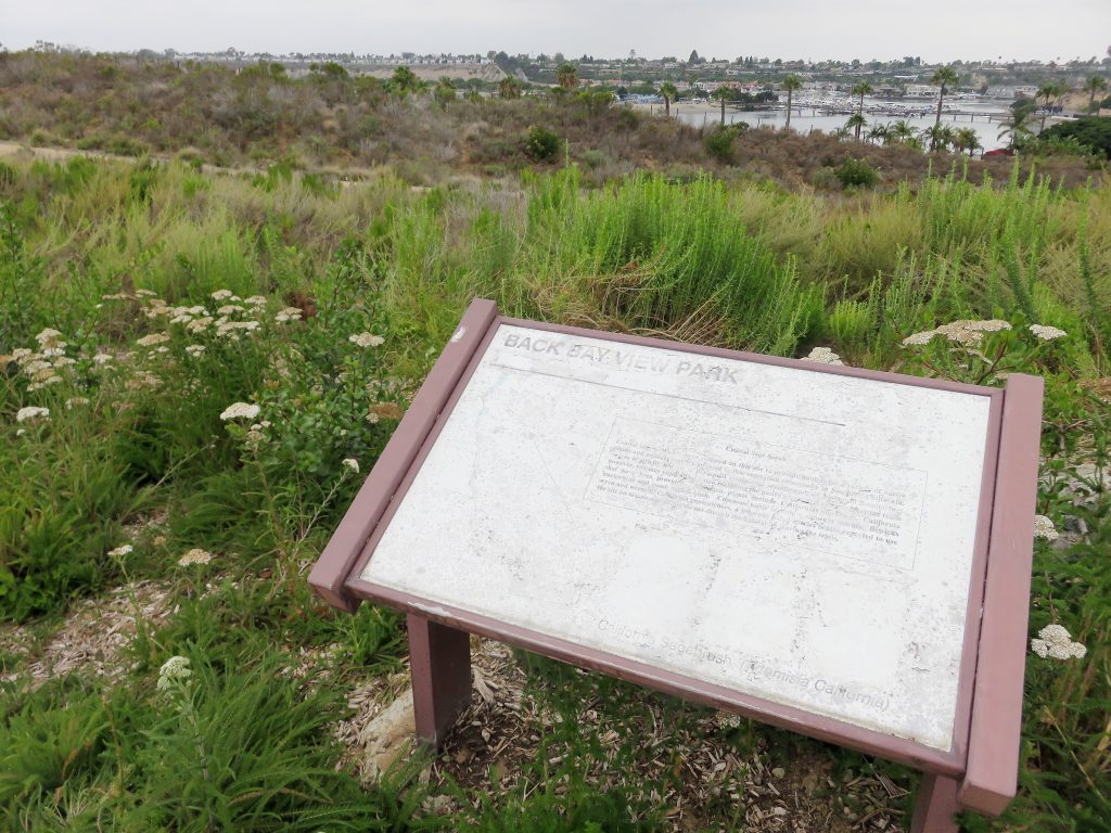 A faded interpretive sign at Back Bay View Park. — Photo by Sara Hall ©