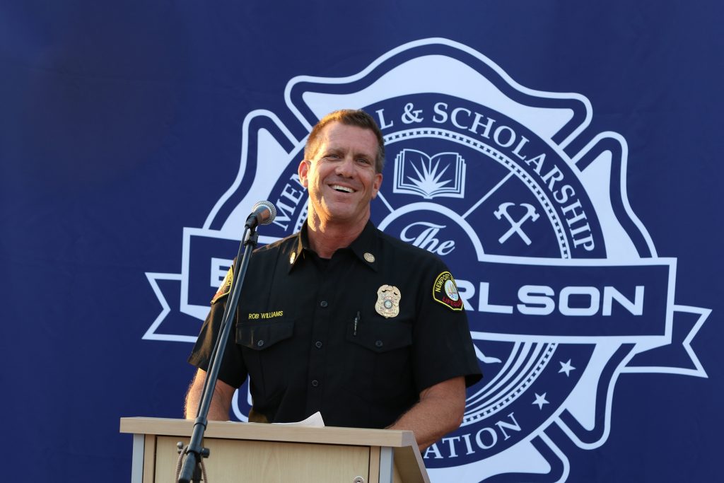 Newport Beach Lifeguard Chief Rob Williams talks about Ben Carlson, the first Newport Beach lifeguard to die in the line of duty, during a ceremony Wednesday night unveiling a statue in Carlson’s honor. — Photo by Jim Collins ©