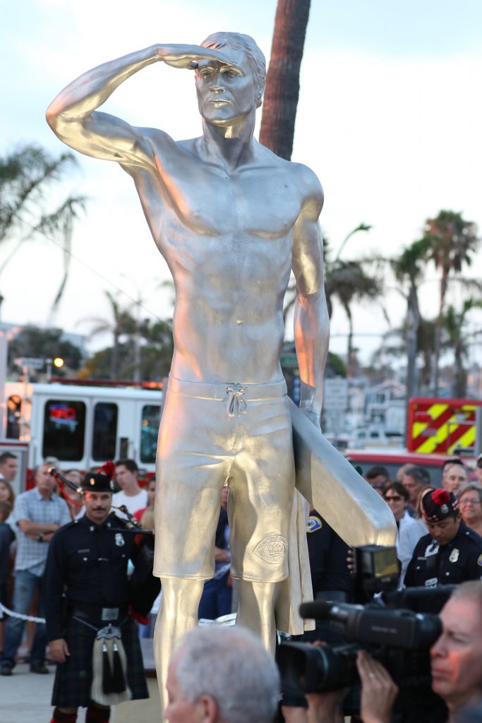 A statue of Ben Carlson, the first Newport Beach lifeguard to die in the line of duty, was unveiled on Wednesday night. — Photo by Jim Collins ©