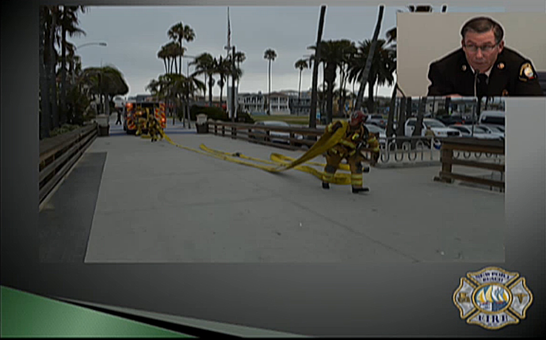 NBFD Assistant Chief Chip Duncan describes the simulation Newport firefighters conducted on the Balboa Pier recently during his presentation. — Screenshot from NBFD presentation