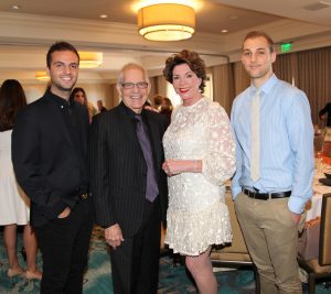 Dodge College students and Women of Chapman endowment recipients Andrew Primavera, left, and Robert "Robby" Bracker, right, with Dodge College Dean Bob Bassett and WOC Endowment Chair Adrienne Brandes