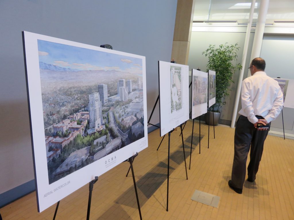 A resident checks out artist renderings of the Museum House project at Speak Up Newport’s meeting on Wednesday. — Photo by Sara Hall ©