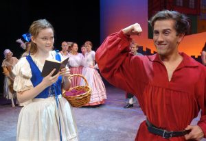 Gaston (Anthony Cervero) shows off for a disinterested Belle (Katherine Parrish) in the Summer Players production of Disney’s Beauty and the Beast, August 12-14 on South Caost Repertory’s Julianne Argyros Stage