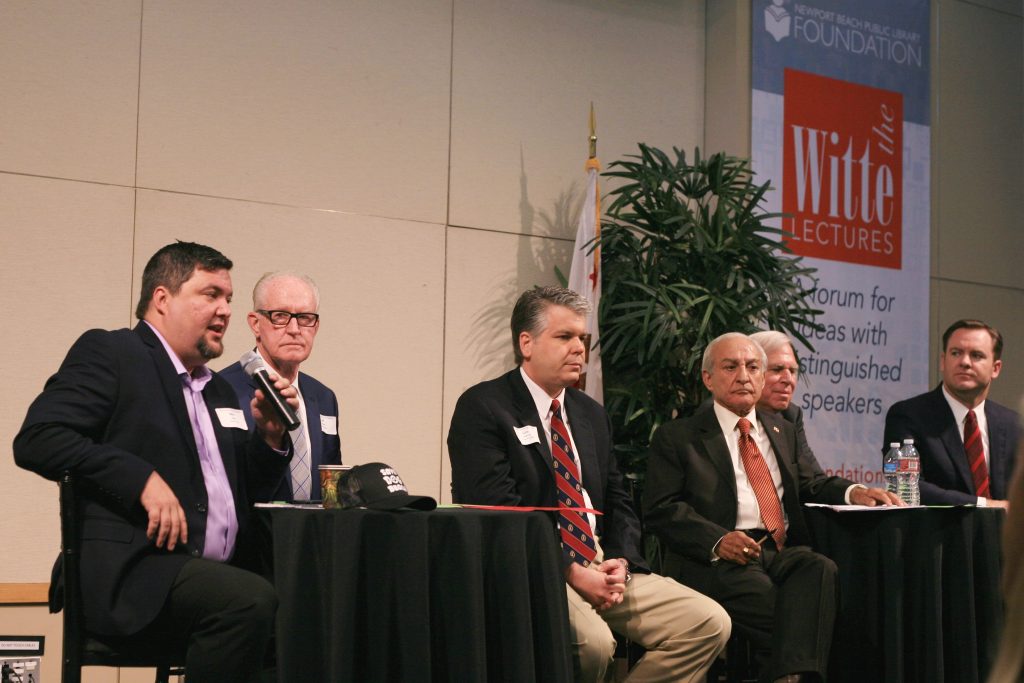 (left to right) Mike Glenn, Jeff Herdman, and Lee Lowrey for District 5; and Fred Ameri, Phil Greer, and Will O’Neill for District 7. Moderator Lucy Dunn. At the Newport Beach Chamber of Commerce hosted candidate forum Tuesday. (Brad Avery in District 2 is off camera to the left) — Photo by Sara Hall ©