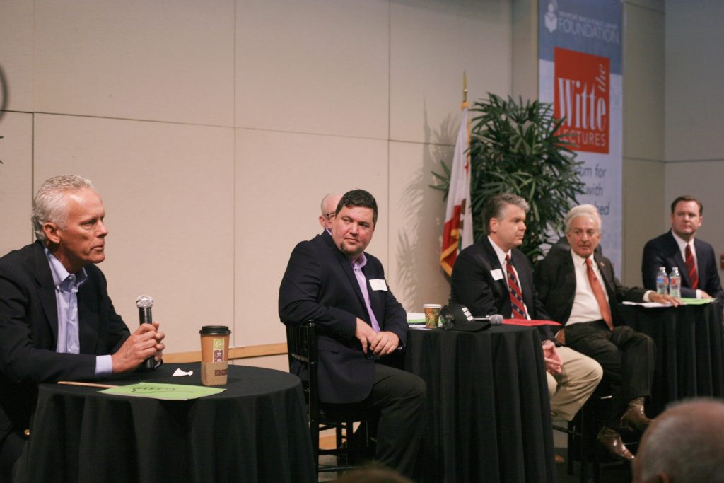 (left to right) Brad Avery in District 2 speaking as Mike Glenn, Jeff Herdman (hidden slightly in background), and Lee Lowrey for District 5; and Fred Ameri, Phil Greer (hidden slightly in background), and Will O’Neill for District 7 at the Newport Beach Chamber of Commerce hosted candidate forum Tuesday. — Photo by Sara Hall ©