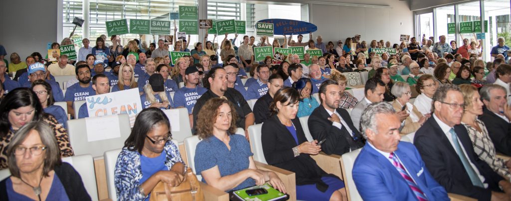 The crowd inside council chambers listens to the hearing on Banning Ranch on Wednesday. — Photo by Charles Weinberg ©