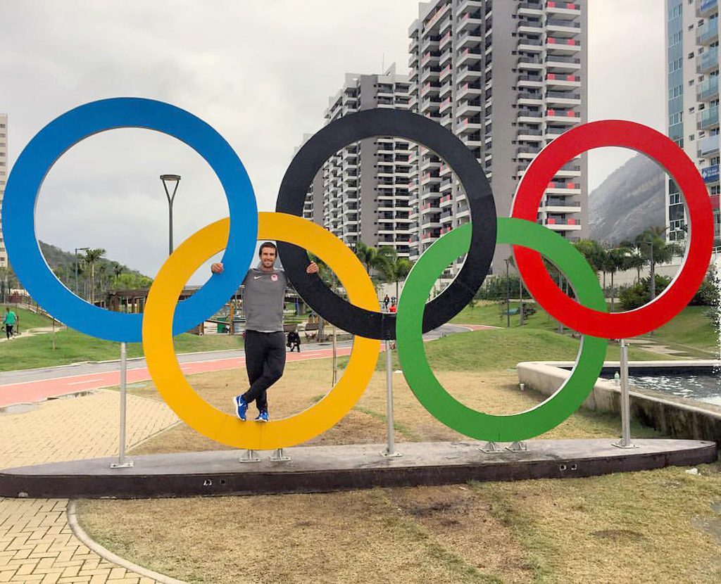 Charlie Buckingham, a member of the U.S. sailing team for the 2016 Olympics in Rio, poses for a photo with the Olympic rings.  — Photo courtesy of Charlie Buckingham ©