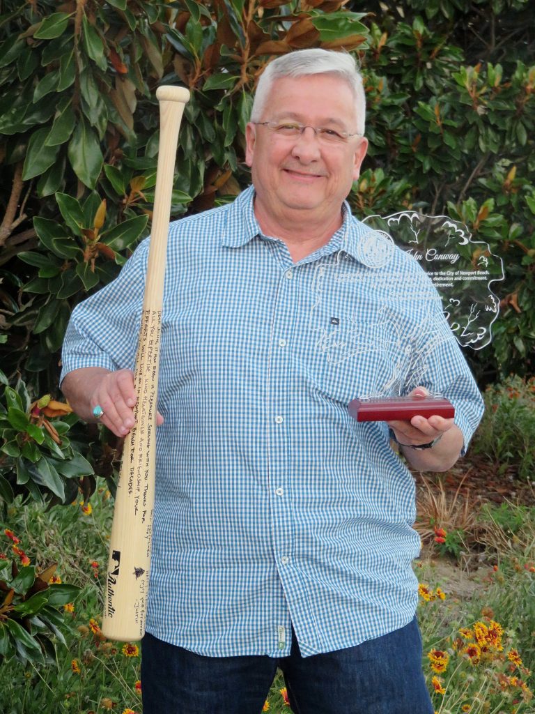 John Conway with his signed baseball bat from the recreation department and award for his service from the pubic works department. — Photo by Sara Hall ©