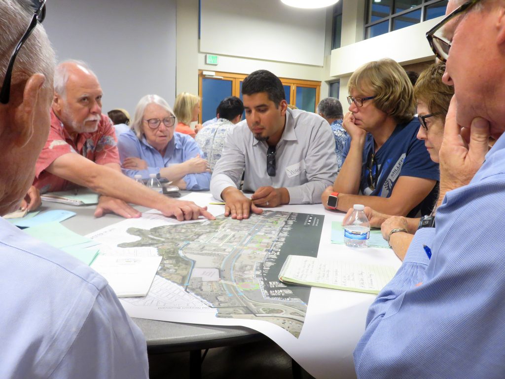 Jaime Murillo, a Newport Beach city senior planner, discusses the Mariners’ Mile Revitalization Master Plan with members of the public during a special Planning Commission meeting and community workshop on Monday. — Photo by Sara Hall ©